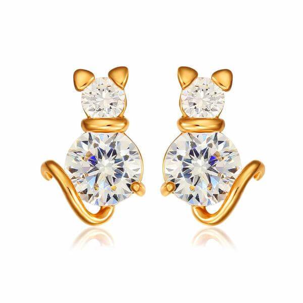 golden cat earrings with white berg crystals on white background