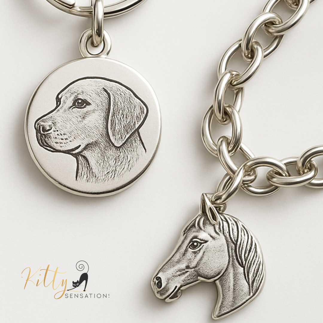 Silver keychain with dog and horse head charms on a white background