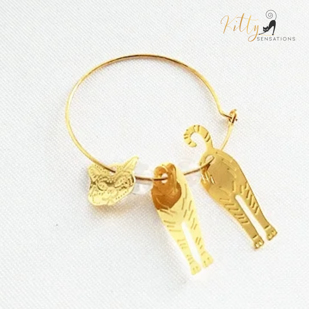 Moving Cat Hoop Earrings - Bronze-Gold Color: These absolutely gorgeous and dynamic earrings are a must have for a cat loving lady. The subtle bronze-gold colored earrings show pierced profiles of a cute kitty in three different bronze-gold colored foils that move as you move, depicting the graceful movements of your lovely cat. https://www.kittysensations.com/products/moving-cat-hoop-earrings