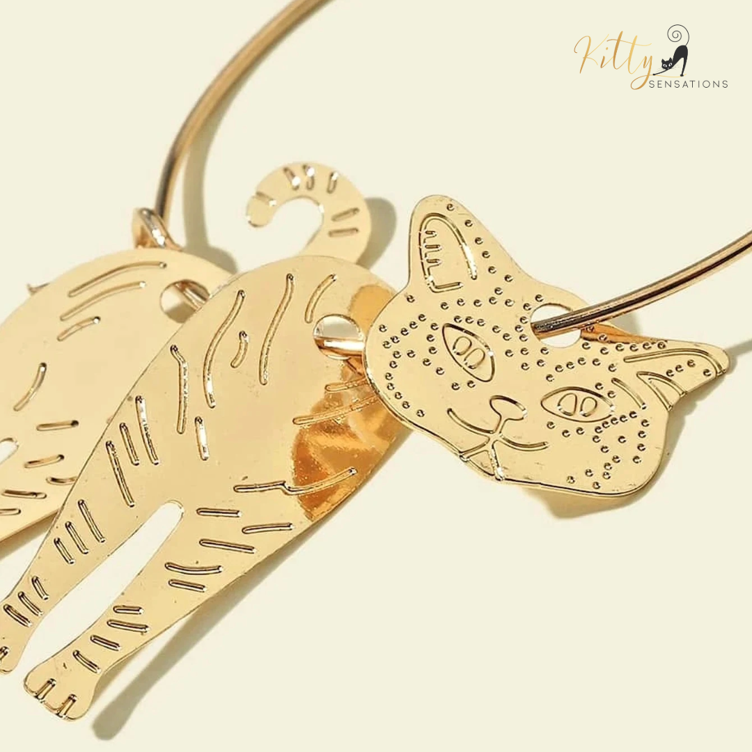 Moving Cat Hoop Earrings - Bronze-Gold Color: These absolutely gorgeous and dynamic earrings are a must have for a cat loving lady. The subtle bronze-gold colored earrings show pierced profiles of a cute kitty in three different bronze-gold colored foils that move as you move, depicting the graceful movements of your lovely cat. https://www.kittysensations.com/products/moving-cat-hoop-earrings