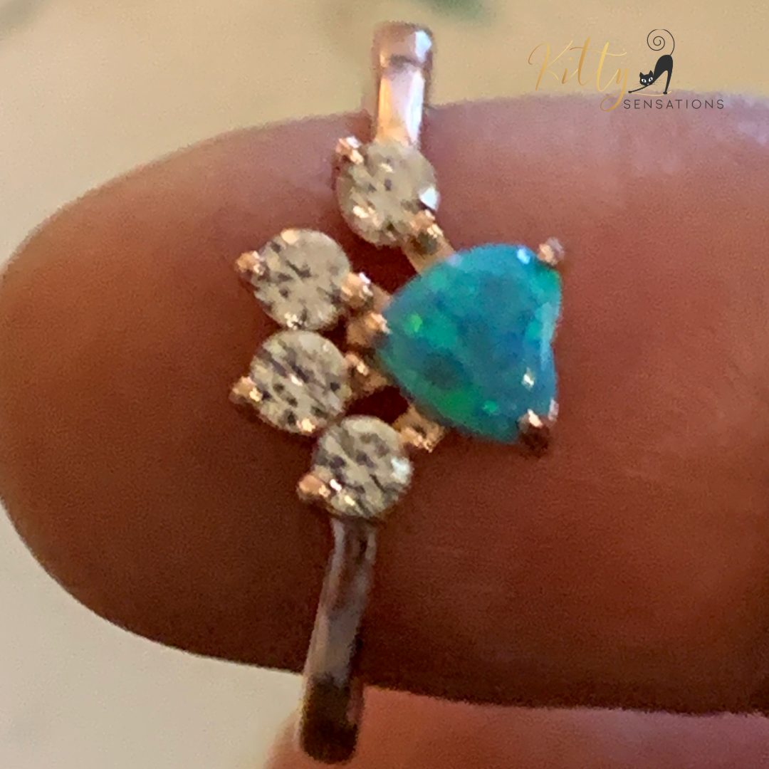 Rose gold plated solid 925 sterling silver cat paw ring with a central heart-shaped blue fire opal stone and four smaller AAA quality clear Cubic Zirconia stones for kitty toes.