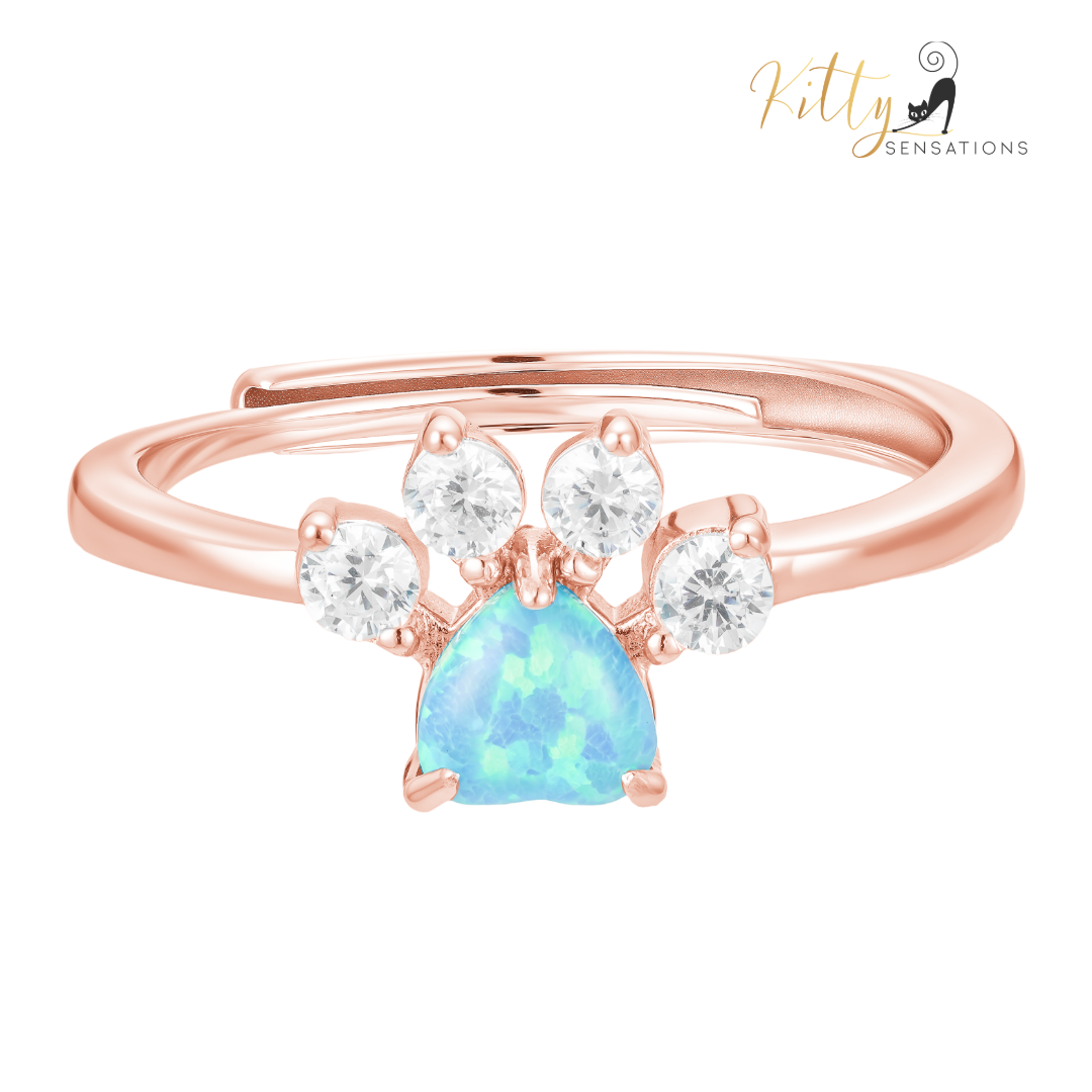 Rose gold plated solid 925 sterling silver cat paw ring with a central heart-shaped blue fire opal stone and four smaller AAA quality clear Cubic Zirconia stones for kitty toes.