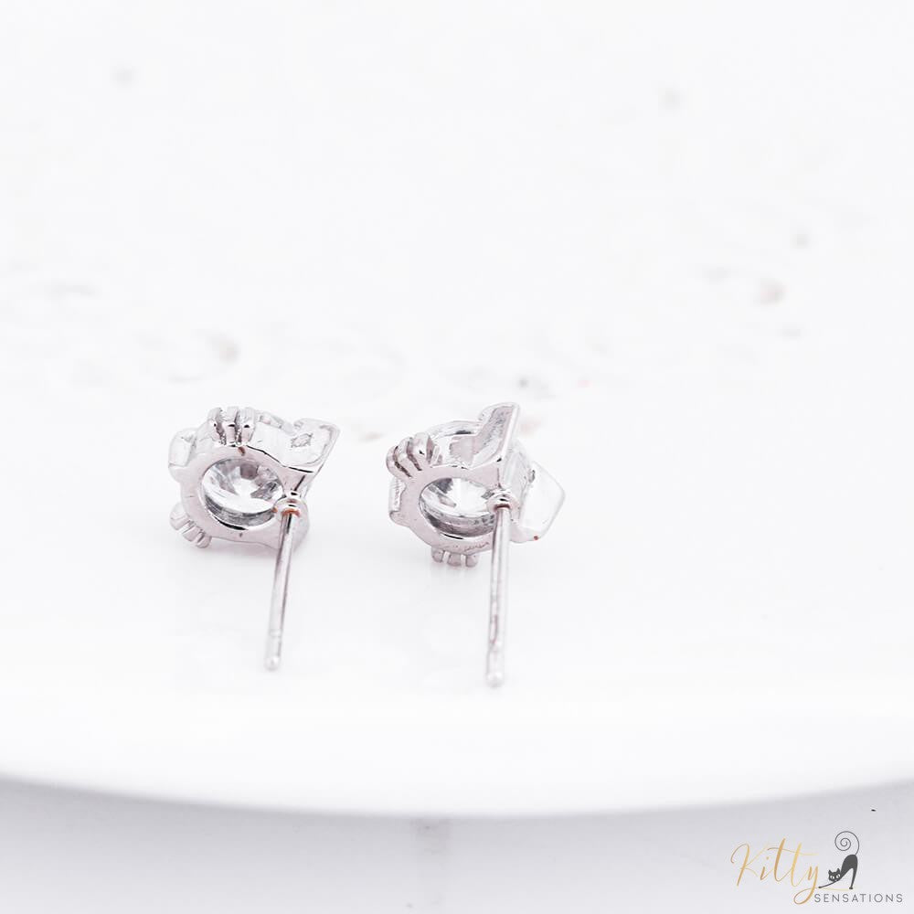 backside of silver cat earrings with cubic zirconias on white background kittysensations