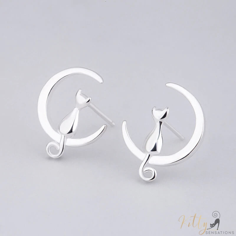 cat moon earrings in sterling silver on gray surface 21939147-light-yellow-gold-color