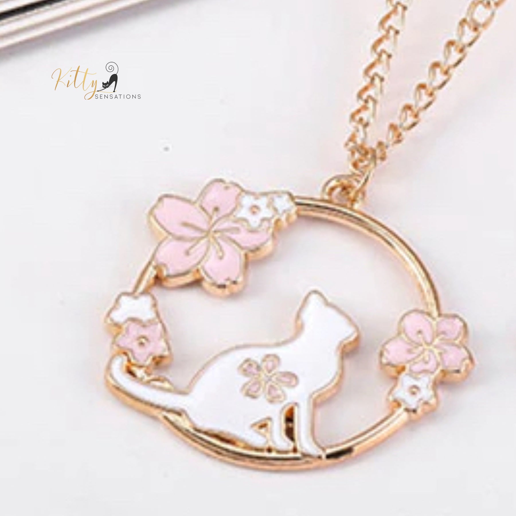 www.KittySensations.com: Jasmines and Orchids Cat Necklace - Enameled - Adjustable Length ($22.30): https://www.kittysensations.com/products/jasmines-and-orchids-cat-pendant-necklace-enameled