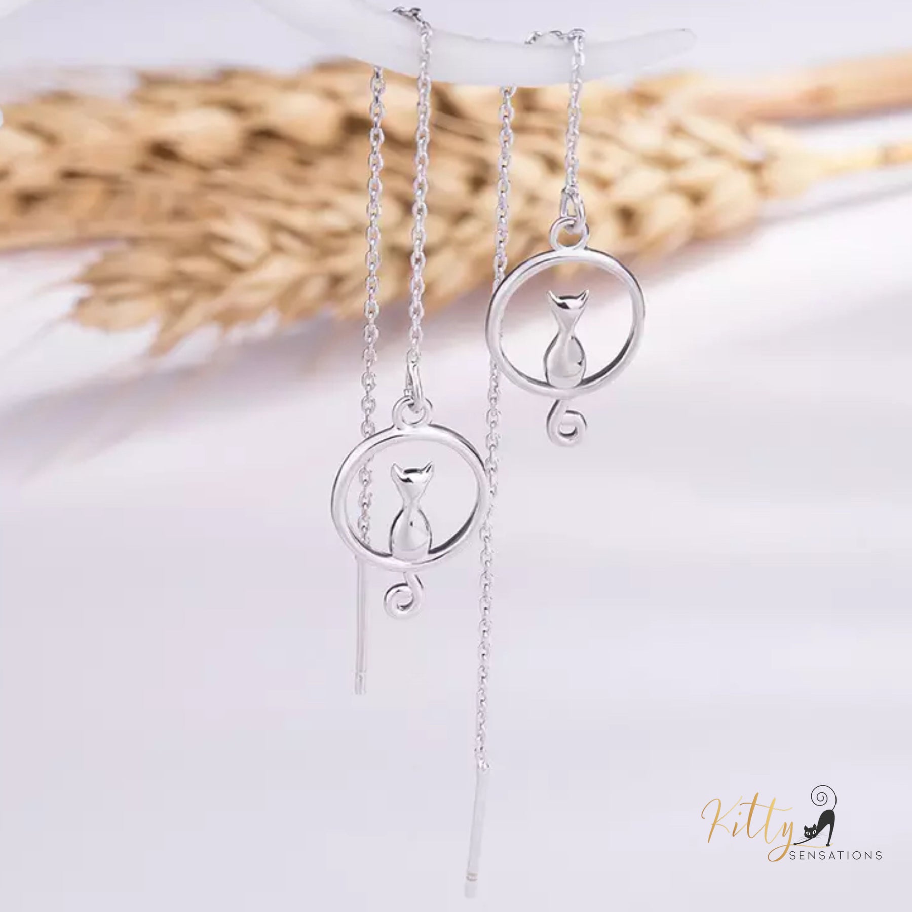 Adjustable Length Moon Kitty Tassel Earrings (White Gold Plated) ($31.13): https://www.kittysensations.com/products/moon-kitty-tassel-earrings-white-gold-plated?_pos=1&_psq=tassel&_ss=e&_v=1.0