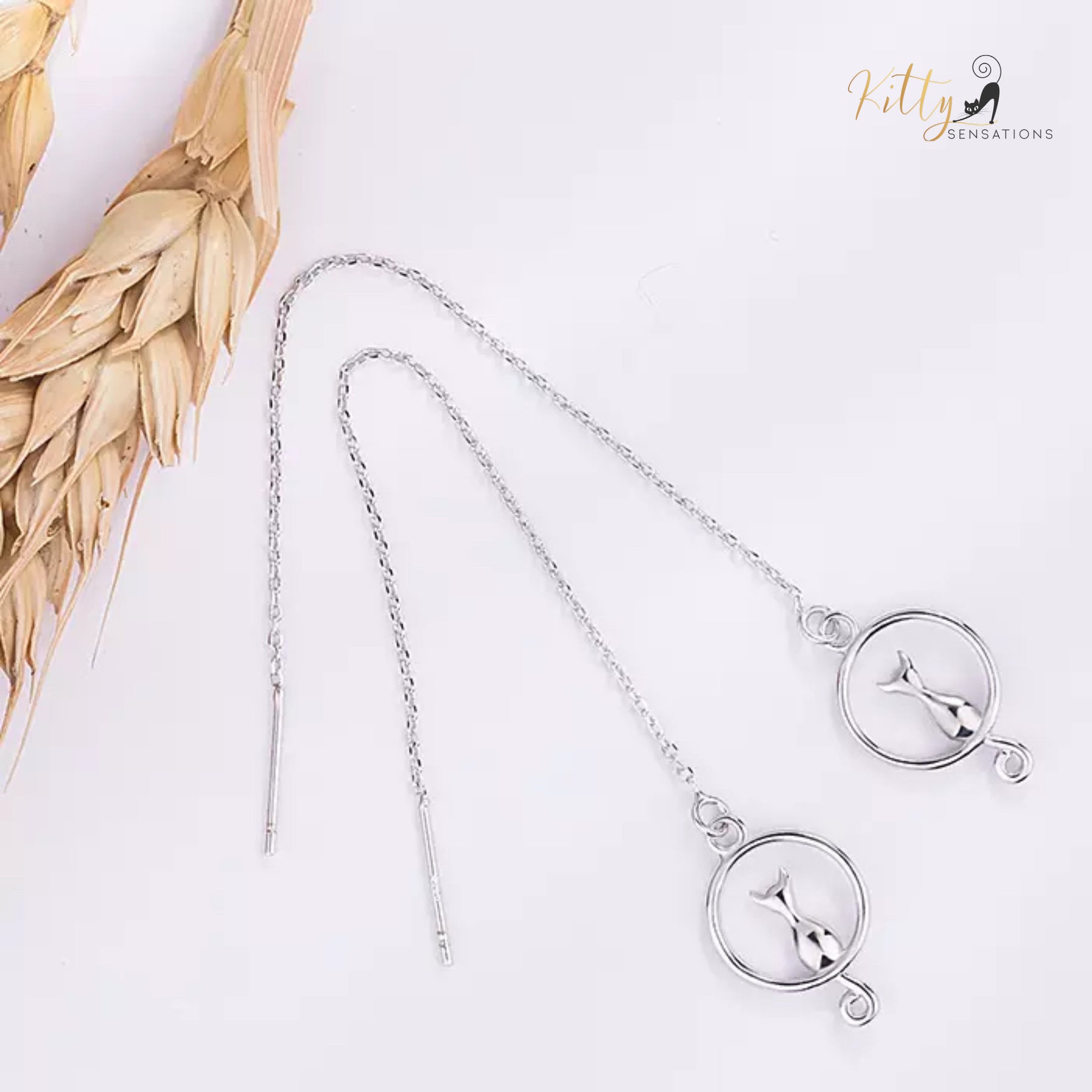 Adjustable Length Moon Kitty Tassel Earrings (White Gold Plated) ($31.13): https://www.kittysensations.com/products/moon-kitty-tassel-earrings-white-gold-plated?_pos=1&_psq=tassel&_ss=e&_v=1.0