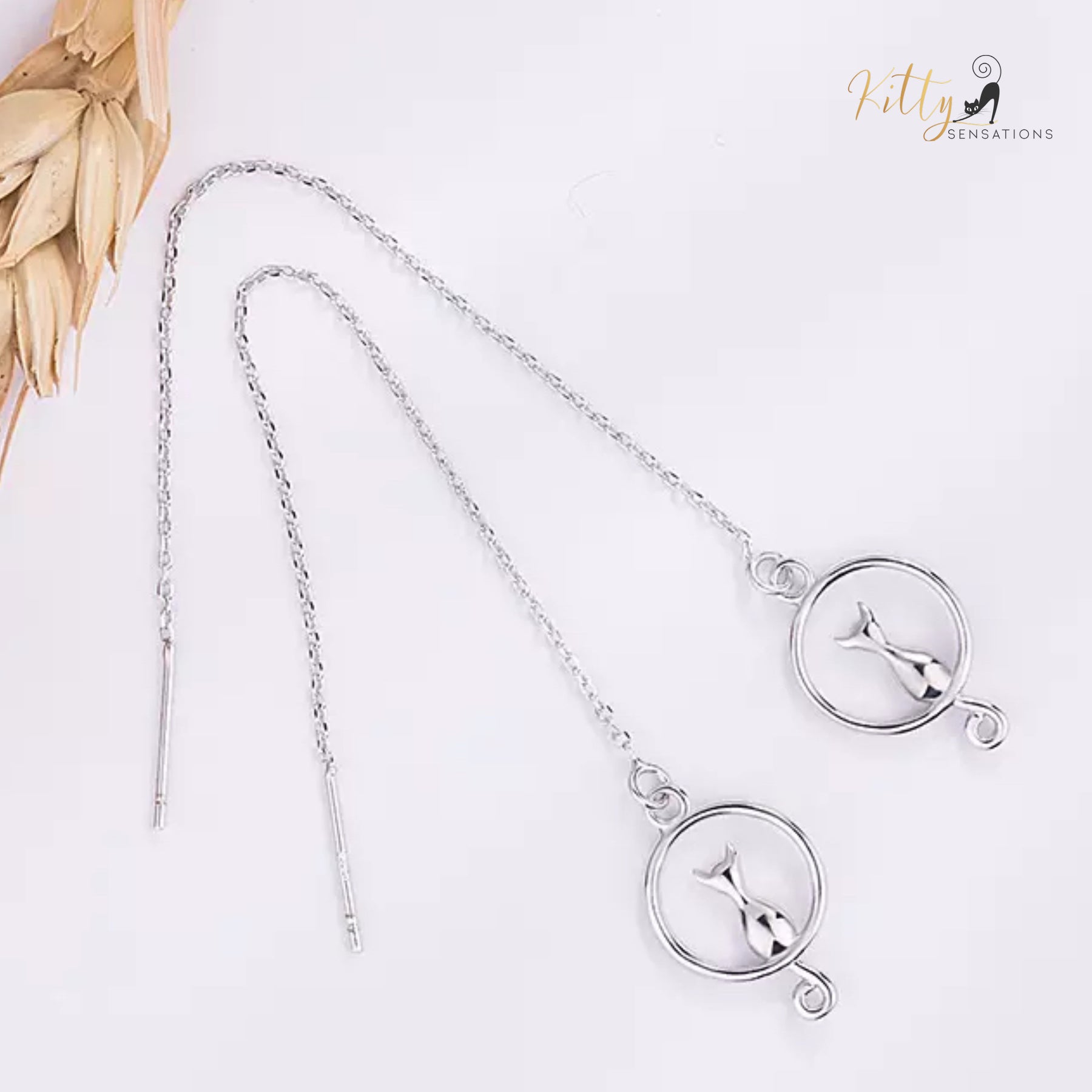 Adjustable Length Moon Kitty Tassel Earrings (White Gold Plated) ($31.13): https://www.kittysensations.com/products/moon-kitty-tassel-earrings-white-gold-plated?_pos=1&_psq=tassel&_ss=e&_v=1.0