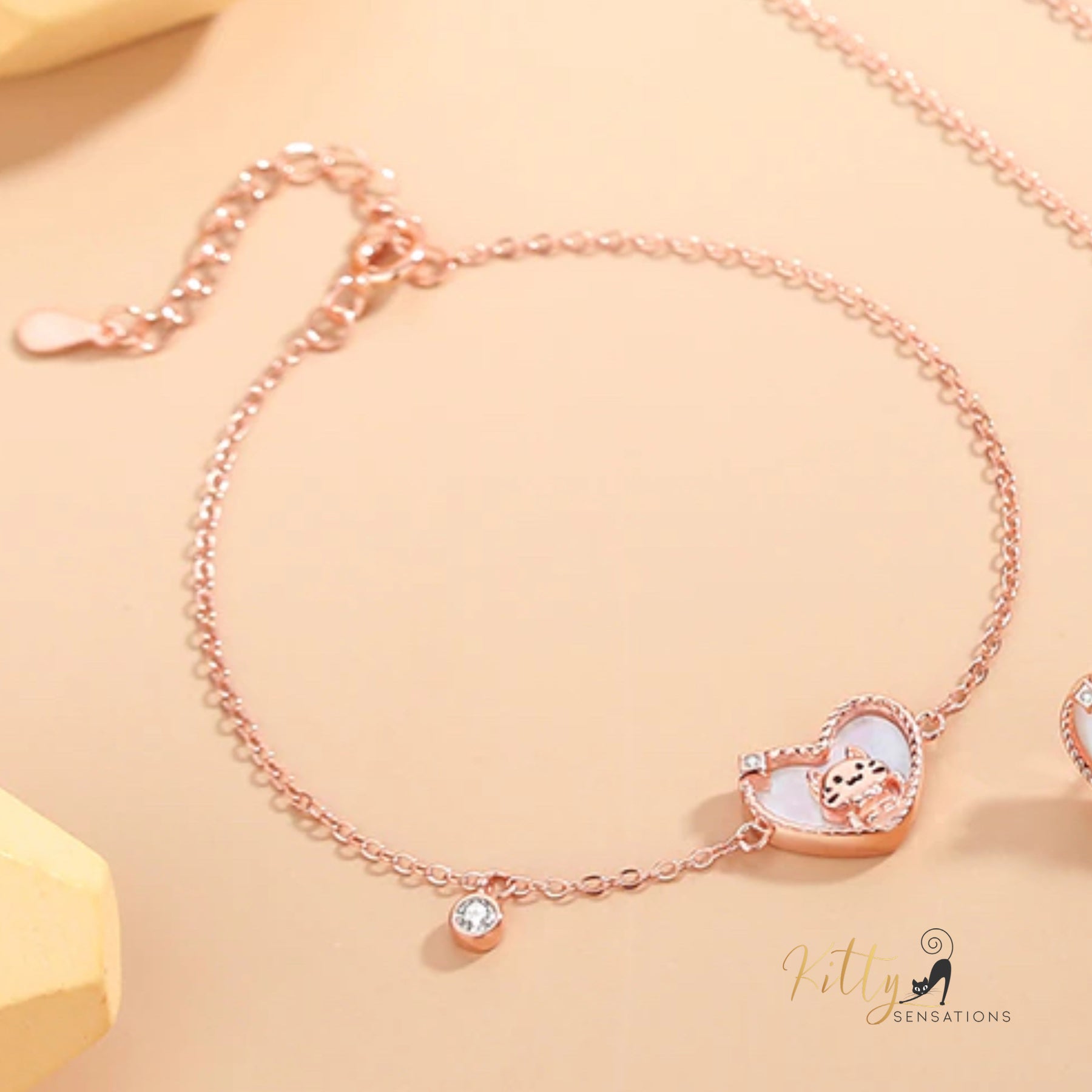 www.KittySensations.com: Raised Kitty in Heart Bracelet in Solid 925 Sterling Silver - Rose Gold Plated ($53.57): https://www.kittysensations.com/products/raised-kitty-in-heart-bracelet-in-solid-925-sterling-silver
