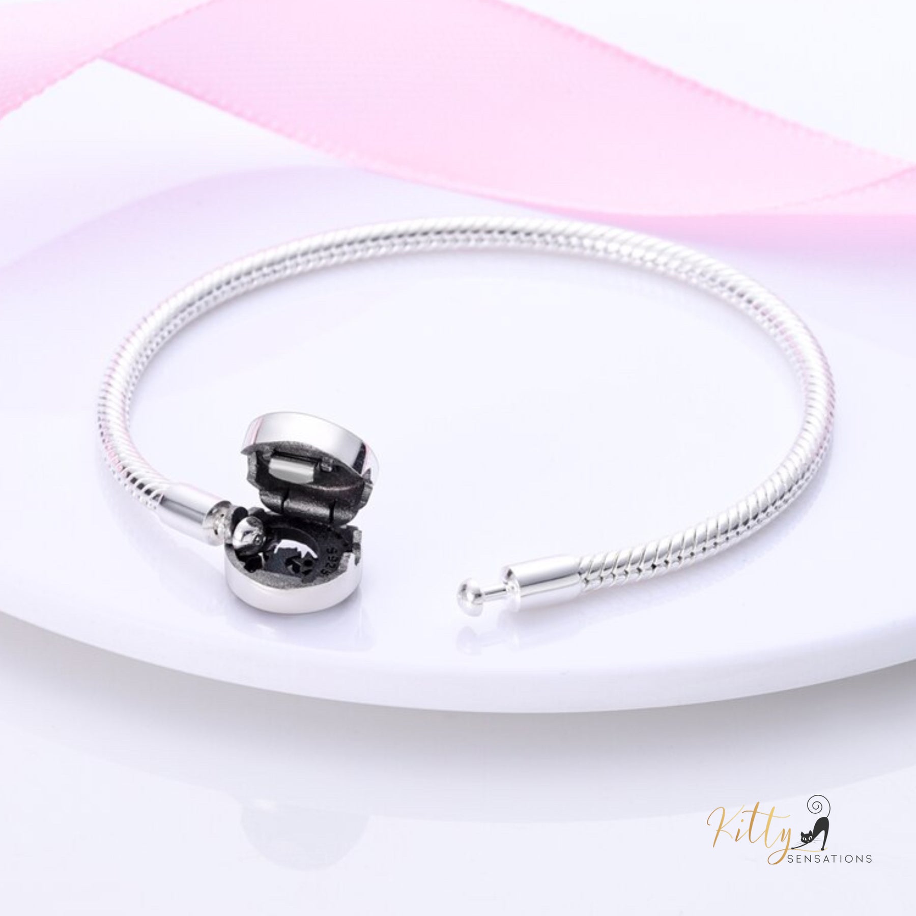 Reaching-for-The-Stars Cat Bracelet in Solid 925 Sterling Silver ($63.11): (Enameled)https://www.kittysensations.com/products/reaching-for-the-stars-cat-bracelet-in-solid-925-sterling-silver-enameled?_pos=2&_psq=reachin&_ss=e&_v=1.0