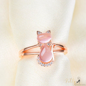 opal cat ring in 14k rose gold on cloth