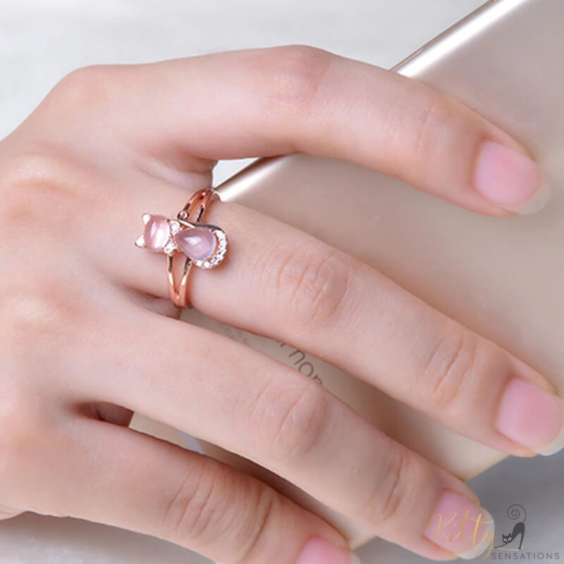 opal cat ring in 14k rose gold worn human hand