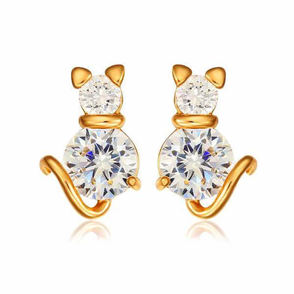 golden cat earrings with white berg crystals on white background