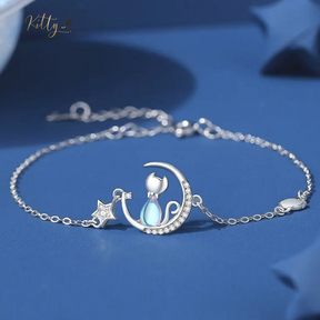 Blue Crystal Moon Kitty Bracelet in Solid 925 Sterling Silver (Adjustable Length) ($80.77): https://www.kittysensations.com/products/blue-crystal-moon-kitty-bracelet-in-solid-925-sterling-silver-adjustable-length