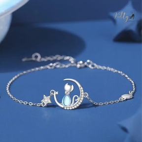 Blue Crystal Moon Kitty Bracelet in Solid 925 Sterling Silver (Adjustable Length) ($80.77): https://www.kittysensations.com/products/blue-crystal-moon-kitty-bracelet-in-solid-925-sterling-silver-adjustable-length