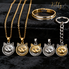 Cat-themed jewelry set including necklaces, a bracelet, and a keychain on a black background.