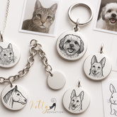 Pet portrait keychains and tags with engraved animal illustrations on a white background.