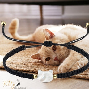 www.KittySensations.com: Natural Mother-of-Pearl and Braided Cord Cat Bracelet (Adjustable Size) ($20.40): https://www.kittysensations.com/products/mother-of-pearl-and-braided-cord-cat-bracelet-adjustable-size