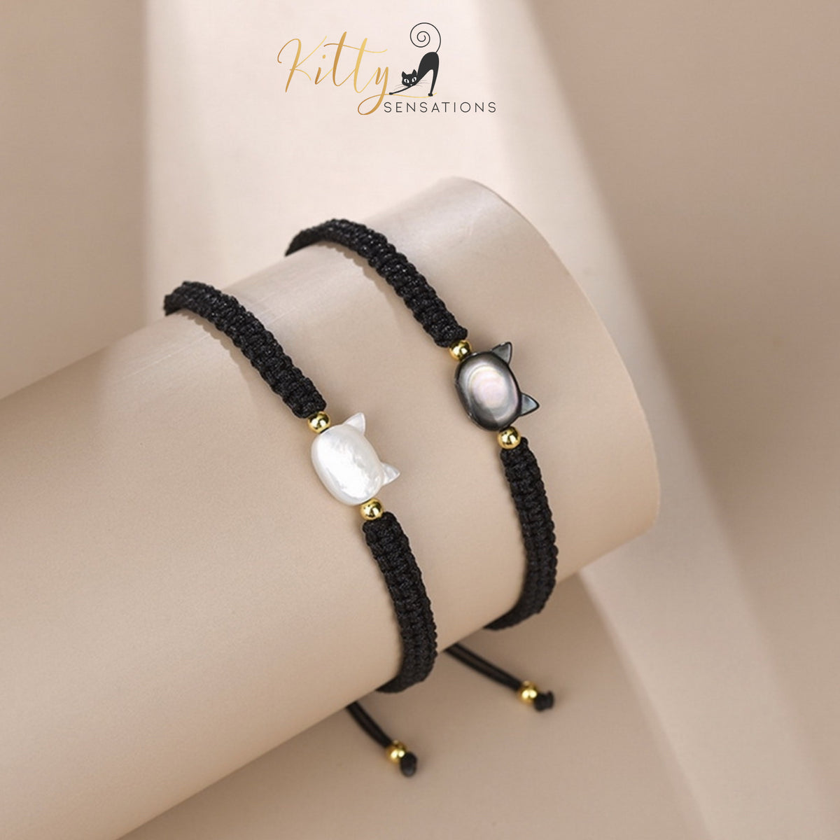 www.KittySensations.com: Natural Mother-of-Pearl and Braided Cord Cat Bracelet (Adjustable Size) ($20.40): https://www.kittysensations.com/products/mother-of-pearl-and-braided-cord-cat-bracelet-adjustable-size
