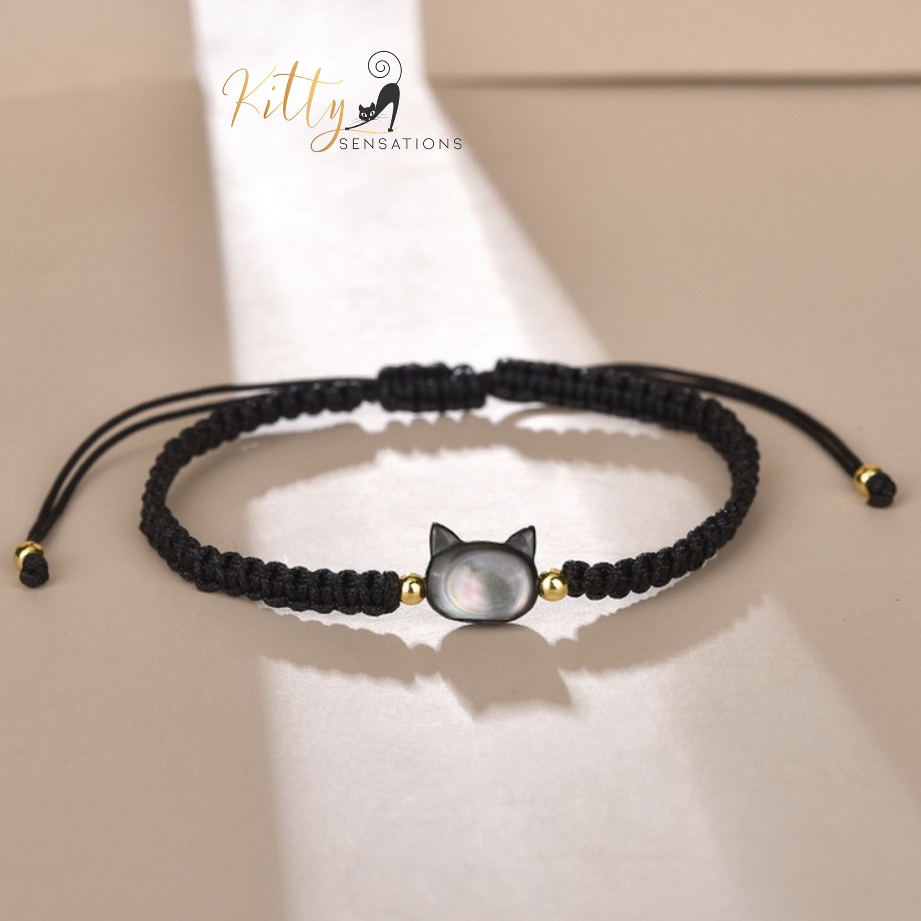 www.KittySensations.com: Natural Mother-of-Pearl and Braided Cord Cat Bracelet (Adjustable Size) ($20.40): https://www.kittysensations.com/products/mother-of-pearl-and-braided-cord-cat-bracelet-adjustable-size