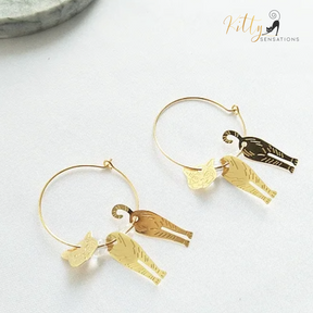 Moving Cat Hoop Earrings - Bronze-Gold Color: These absolutely gorgeous and dynamic earrings are a must have for a cat loving lady. The subtle bronze-gold colored earrings show pierced profiles of a cute kitty in three different bronze-gold colored foils that move as you move, depicting the graceful movements of your lovely cat.  https://www.kittysensations.com/products/moving-cat-hoop-earrings