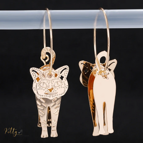 Moving Cat Hoop Earrings - Bronze-Gold Color: These absolutely gorgeous and dynamic earrings are a must have for a cat loving lady. The subtle bronze-gold colored earrings show pierced profiles of a cute kitty in three different bronze-gold colored foils that move as you move, depicting the graceful movements of your lovely cat.  https://www.kittysensations.com/products/moving-cat-hoop-earrings