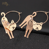 Moving Cat Hoop Earrings - Bronze-Gold Color: These absolutely gorgeous and dynamic earrings are a must have for a cat loving lady. The subtle bronze-gold colored earrings show pierced profiles of a cute kitty in three different bronze-gold colored foils that move as you move, depicting the graceful movements of your lovely cat.  https://www.kittysensations.com/products/moving-cat-hoop-earrings