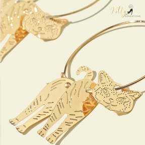 Moving Cat Hoop Earrings - Bronze-Gold Color: These absolutely gorgeous and dynamic earrings are a must have for a cat loving lady. The subtle bronze-gold colored earrings show pierced profiles of a cute kitty in three different bronze-gold colored foils that move as you move, depicting the graceful movements of your lovely cat.  https://www.kittysensations.com/products/moving-cat-hoop-earrings