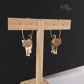 Moving Cat Hoop Earrings - Bronze-Gold Color: These absolutely gorgeous and dynamic earrings are a must have for a cat loving lady. The subtle bronze-gold colored earrings show pierced profiles of a cute kitty in three different bronze-gold colored foils that move as you move, depicting the graceful movements of your lovely cat.  https://www.kittysensations.com/products/moving-cat-hoop-earrings