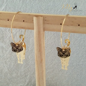 Moving Cat Hoop Earrings - Bronze-Gold Color: These absolutely gorgeous and dynamic earrings are a must have for a cat loving lady. The subtle bronze-gold colored earrings show pierced profiles of a cute kitty in three different bronze-gold colored foils that move as you move, depicting the graceful movements of your lovely cat.  https://www.kittysensations.com/products/moving-cat-hoop-earrings