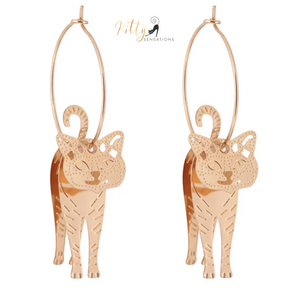 Moving Cat Hoop Earrings - Bronze-Gold Color: These absolutely gorgeous and dynamic earrings are a must have for a cat loving lady. The subtle bronze-gold colored earrings show pierced profiles of a cute kitty in three different bronze-gold colored foils that move as you move, depicting the graceful movements of your lovely cat.  https://www.kittysensations.com/products/moving-cat-hoop-earrings