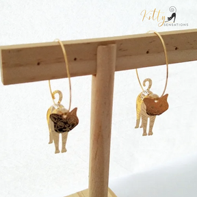 Moving Cat Hoop Earrings - Bronze-Gold Color: These absolutely gorgeous and dynamic earrings are a must have for a cat loving lady. The subtle bronze-gold colored earrings show pierced profiles of a cute kitty in three different bronze-gold colored foils that move as you move, depicting the graceful movements of your lovely cat.  https://www.kittysensations.com/products/moving-cat-hoop-earrings