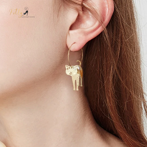 Moving Cat Hoop Earrings - Bronze-Gold Color: These absolutely gorgeous and dynamic earrings are a must have for a cat loving lady. The subtle bronze-gold colored earrings show pierced profiles of a cute kitty in three different bronze-gold colored foils that move as you move, depicting the graceful movements of your lovely cat.  https://www.kittysensations.com/products/moving-cat-hoop-earrings