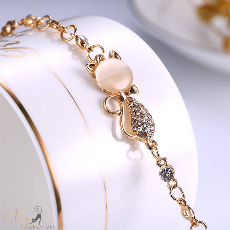 golden cat bracelet with an opal 8832864