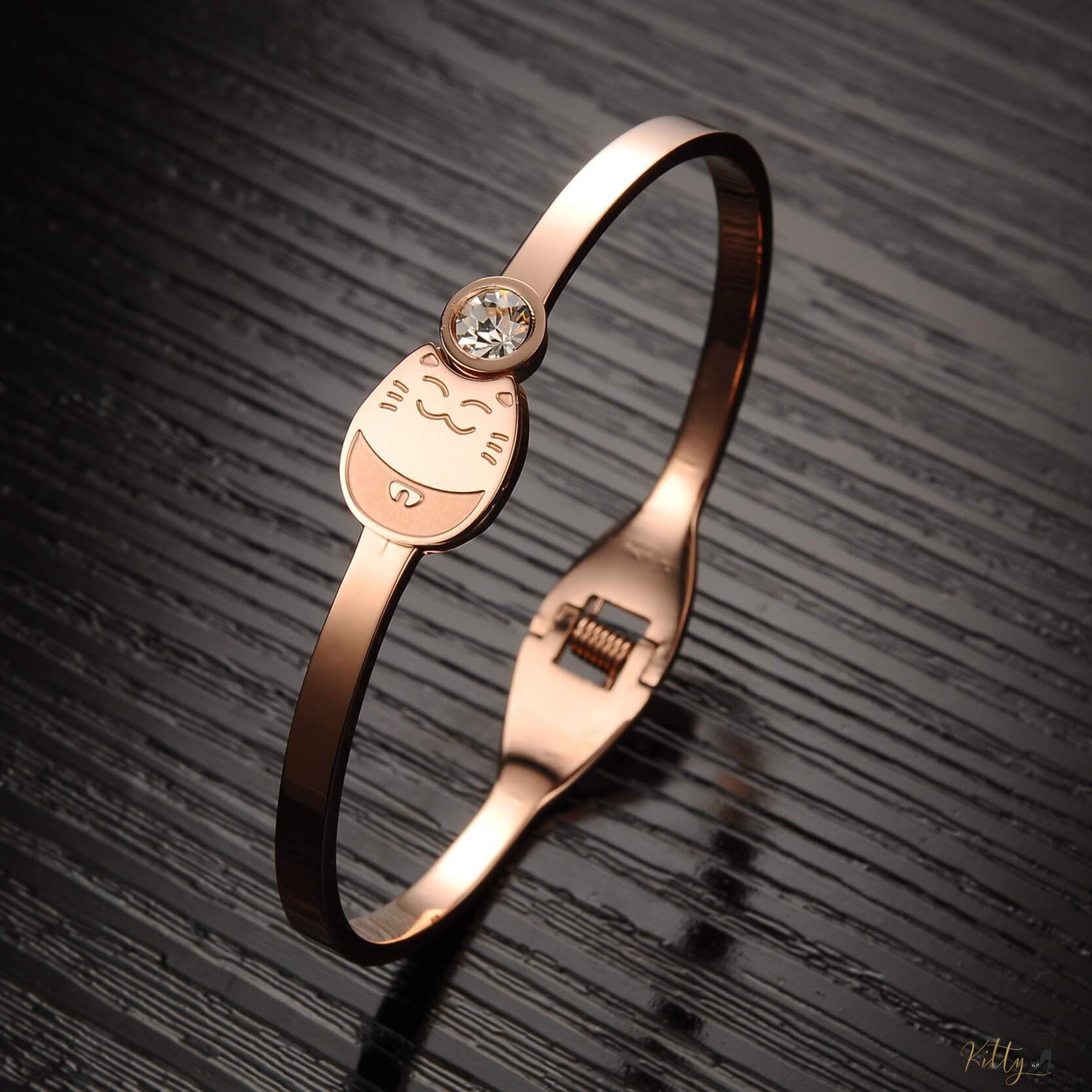 Rose Gold Cat Bracelet with a Cubic Zirconia on black background kittysensations 2107716