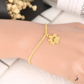 golden cat paw bracelet on human wrist
