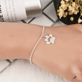 silver cat paw bracelet on human wrist