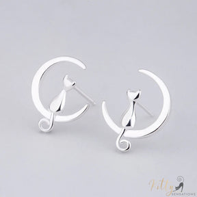 cat moon earrings in sterling silver on gray surface 21939147-light-yellow-gold-color