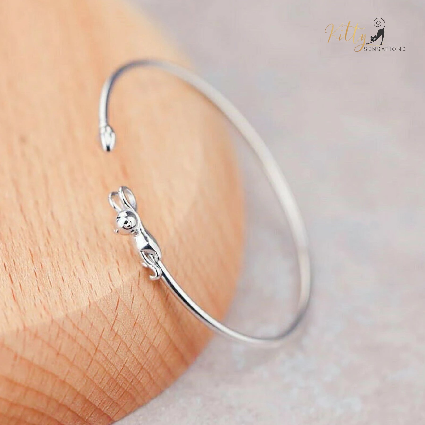 www.KittySensations.com Hanging Cat Cuff Bracelet - Silver Plated (Adjustable) ($12.01): https://www.kittysensations.com/products/hanging-cat-cuff-bracelet-silver-plated-adjustable