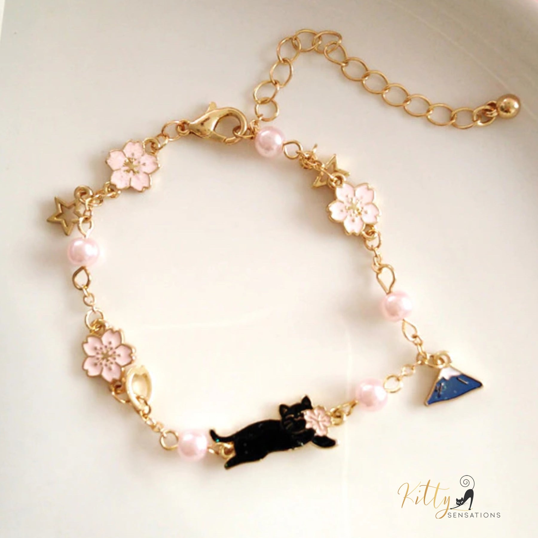 www.KittySensations.com: Jasmines and Stars Cat Bracelet (Enameled) - Adjustable Length ($15.14): https://www.kittysensations.com/products/jasmines-and-stars-cat-bracelet-enameled-adjustable-length