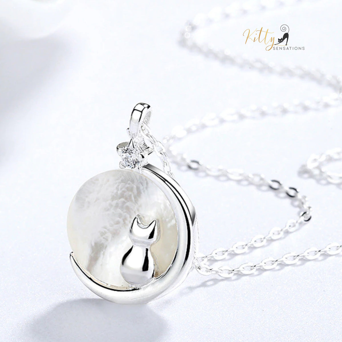 www.KittySensations.com Mother-of-Pearl Moon Kitty Necklace in Solid 925 Sterling Silver (Platinum or Gold Plated) ($35.85): https://www.kittysensations.com/products/mother-of-pearl-moon-kitty-necklace-in-solid-925-sterling-silver-platinum-or-gold-plated?variant=40121008848962