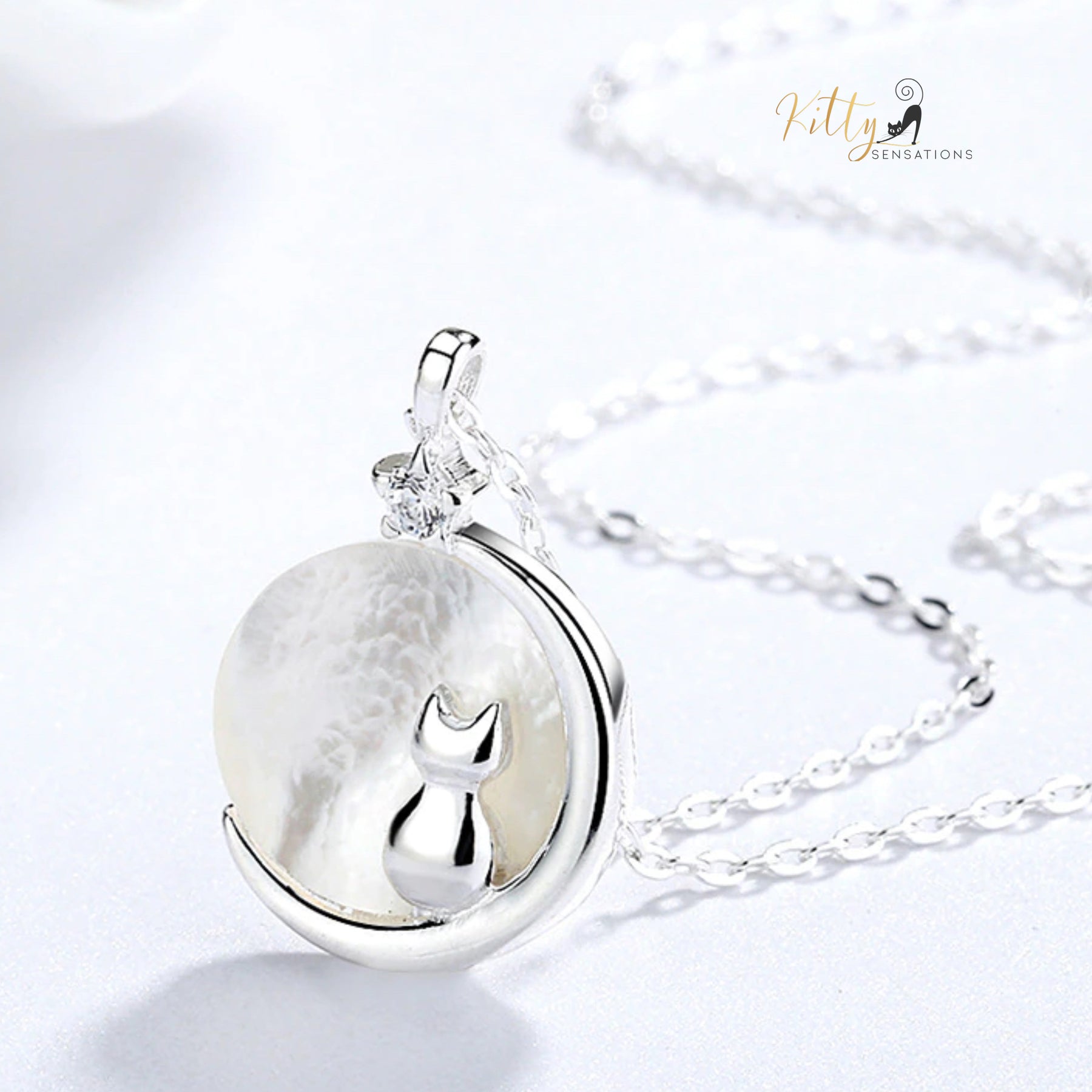 www.KittySensations.com Mother-of-Pearl Moon Kitty Necklace in Solid 925 Sterling Silver (Platinum or Gold Plated) ($35.85): https://www.kittysensations.com/products/mother-of-pearl-moon-kitty-necklace-in-solid-925-sterling-silver-platinum-or-gold-plated?variant=40121008848962
