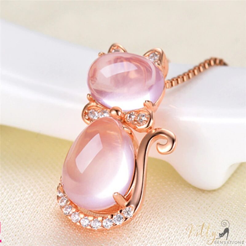 opal cat necklace leaning on white object 18300317