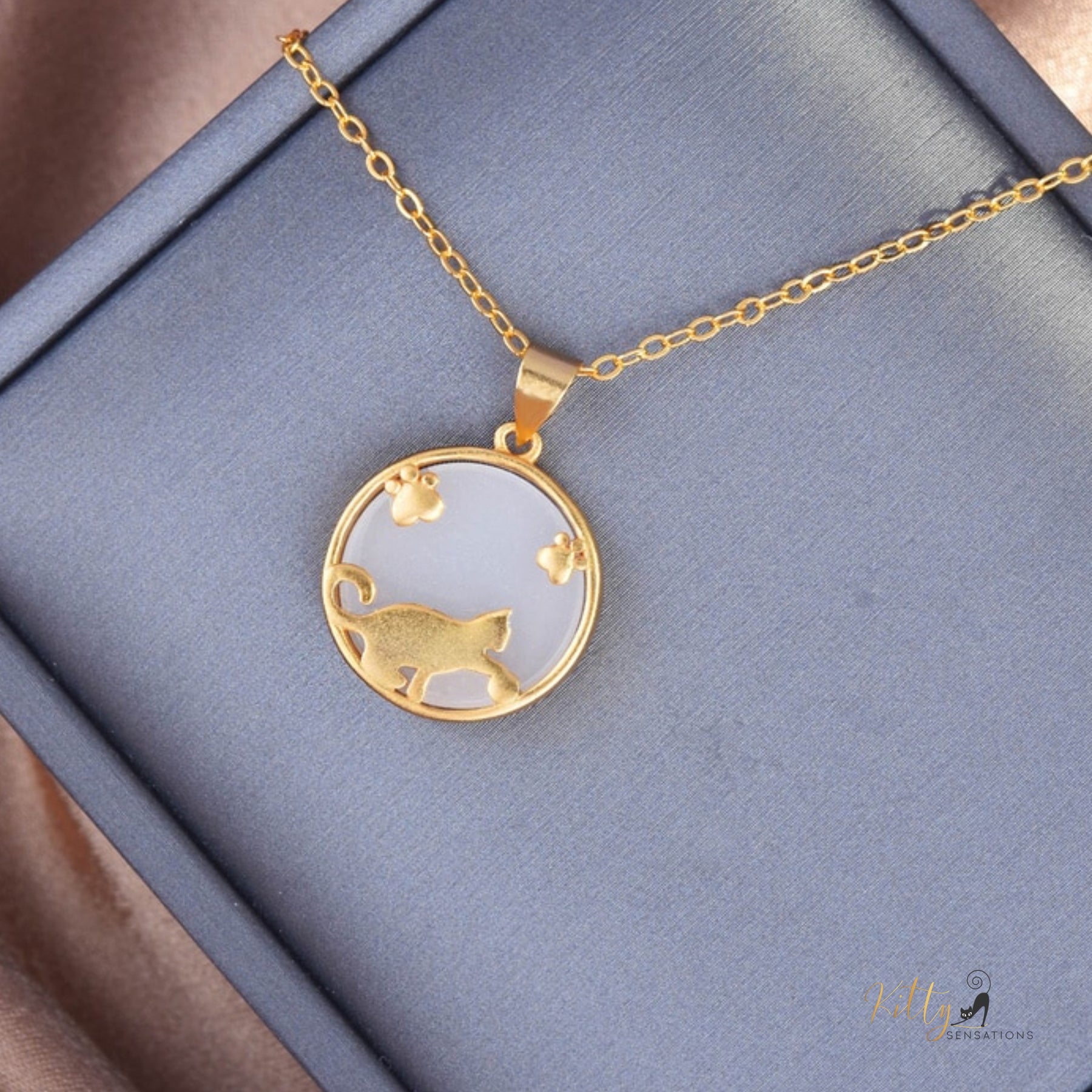Playful Cat Natural Jade Necklace in Solid 925 Sterling Silver (Gold Plated) ($48.32): https://www.kittysensations.com/products/playful-cat-natural-jade-necklace-in-solid-925-sterling-silver-gold-plated?_pos=2&_psq=PLAYFUL+CAT+JADE&_ss=e&_v=1.0