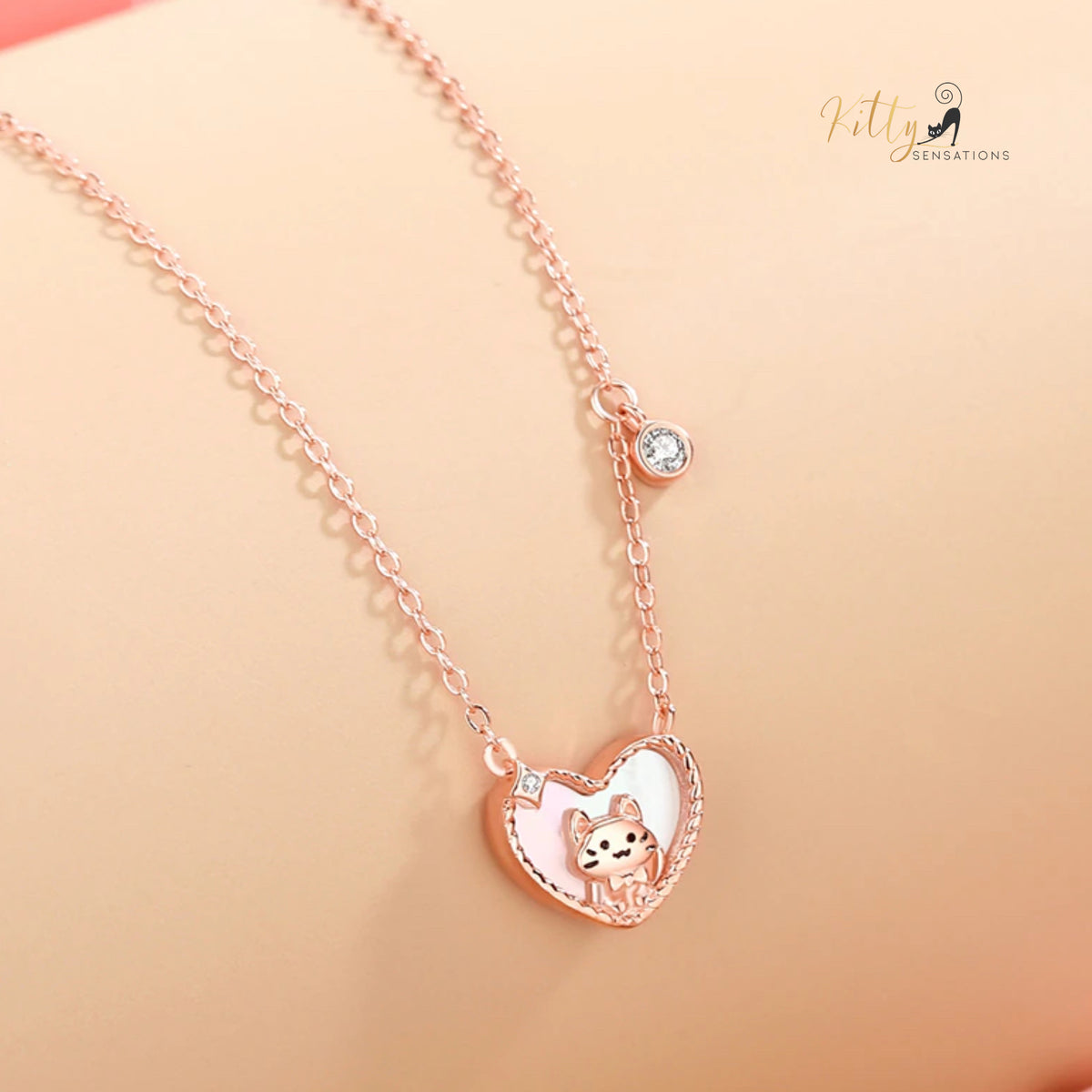 www.KittySensations.com: Raised Kitty in Heart Necklace in Solid 925 Sterling Silver - Rose Gold Plated ($58.04): https://www.kittysensations.com/products/raised-kitty-in-heart-necklace-in-solid-925-sterling-silver-rose-gold-plated