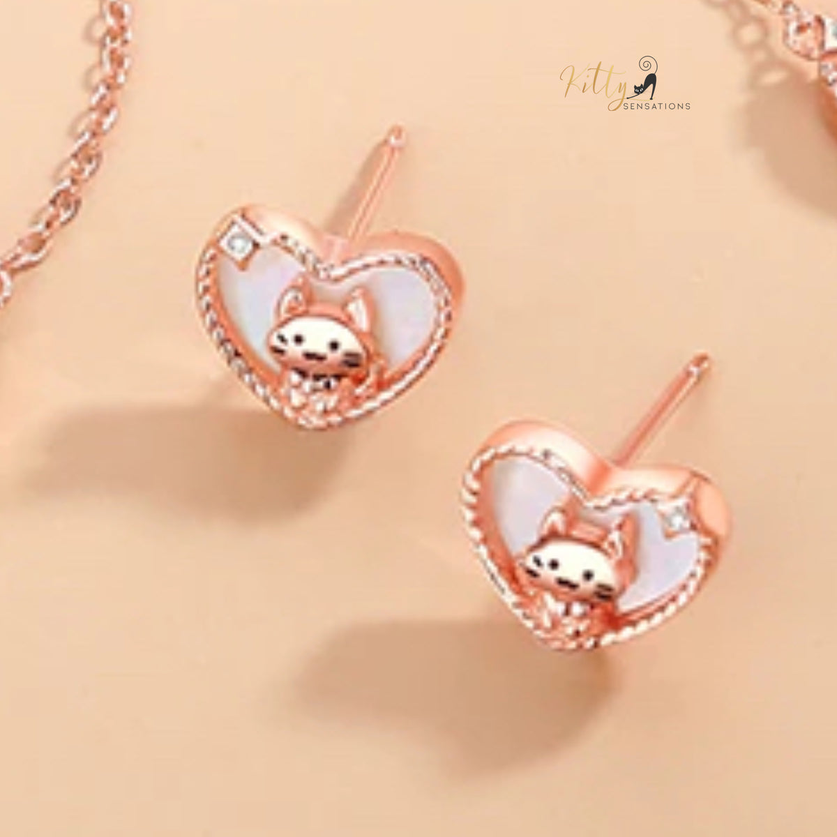 www.KittySensations.com: Raised Kitty in Heart Stud Earrings in Solid 925 Sterling Silver - Rose Gold Plated ($38.61): https://www.kittysensations.com/products/raised-kitty-in-heart-study-earrings-in-solid-925-sterling-silver-rose-gold-plated