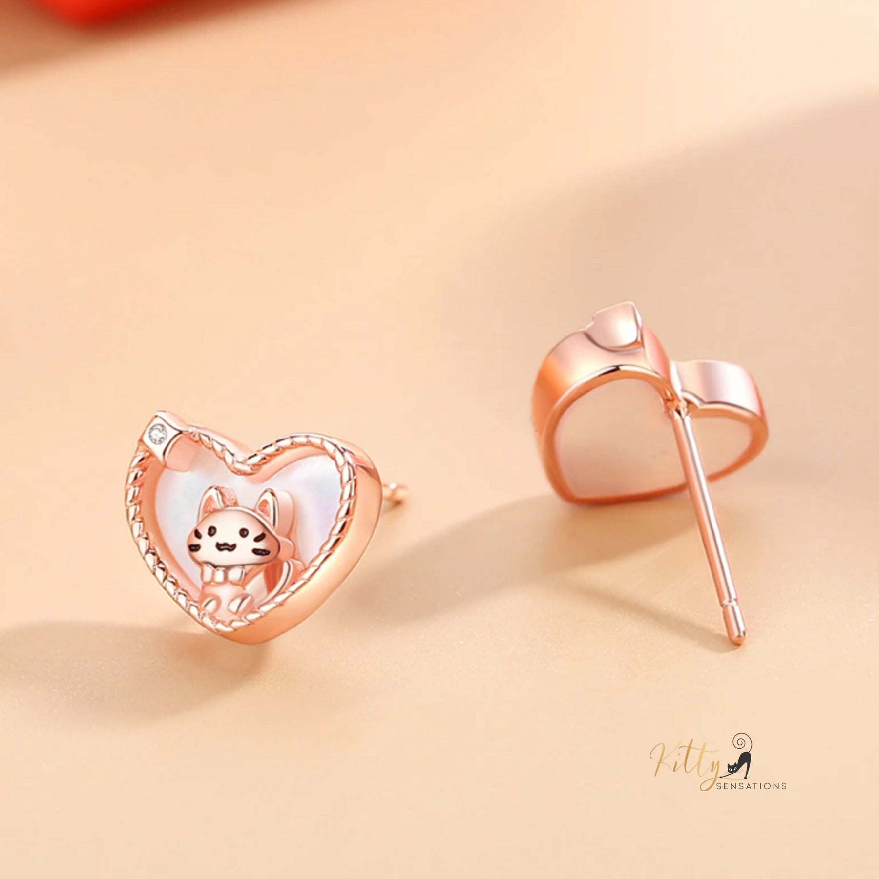 www.KittySensations.com: Raised Kitty in Heart Stud Earrings in Solid 925 Sterling Silver - Rose Gold Plated ($38.61): https://www.kittysensations.com/products/raised-kitty-in-heart-study-earrings-in-solid-925-sterling-silver-rose-gold-plated