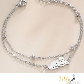 Sitting Cat, Two Chain - Very Feminine - Bracelet (Adjustable Length) ($22.4): https://www.kittysensations.com/products/sitting-kitty-two-chain-very-feminine-bracelet-adjustable-length?variant=40281701974082