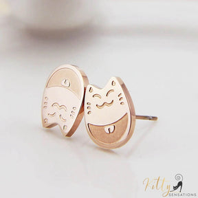 rose gold cat stud earrings on white surface 2631595-rose-gold-color
