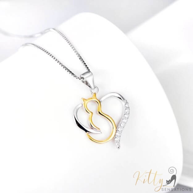 heart cat necklace in silver and gold on white ground 4131000